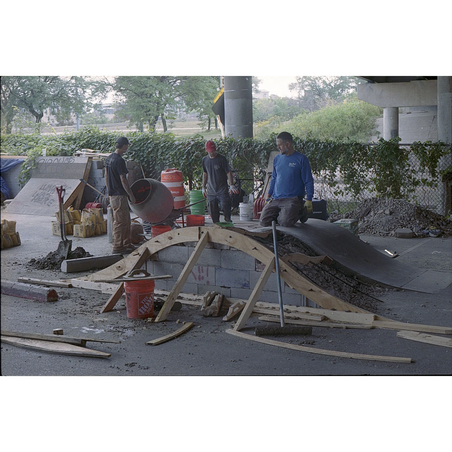 Small group of builders finishing up building a small transition.